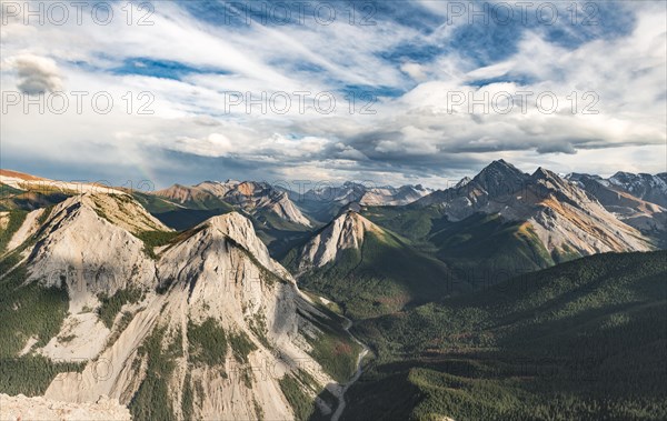 Panoramic view on mountain landscape with rainbow