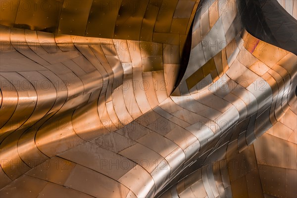 Copper coloured curved facade of the Museum of Pop Culture