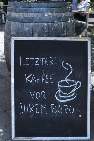 Advertising board in front of a cafe