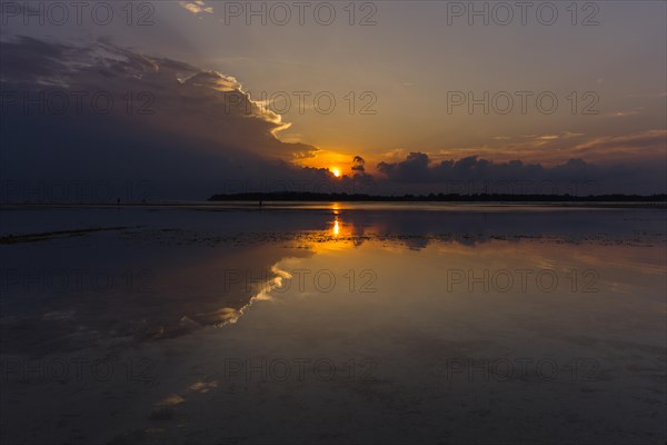Sunset with dark clouds over the sea