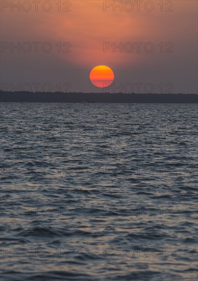 Sunset over the Suriname river near Paramaribo
