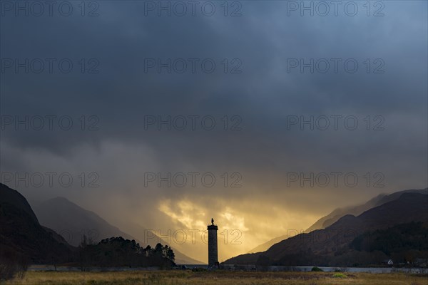 Loch Shiel with Glenfinnan Monument under threatening cloudy sky