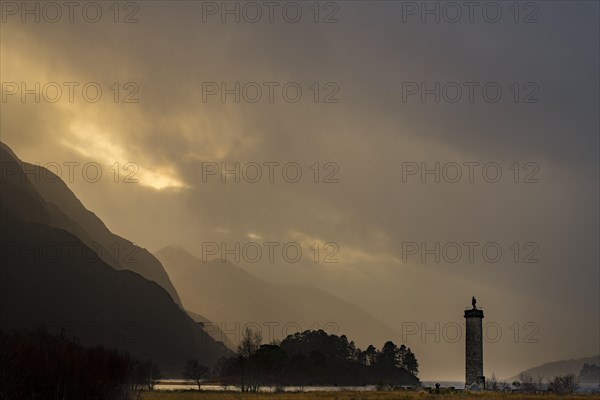 Loch Shiel with Glenfinnan Monument under threatening cloudy sky