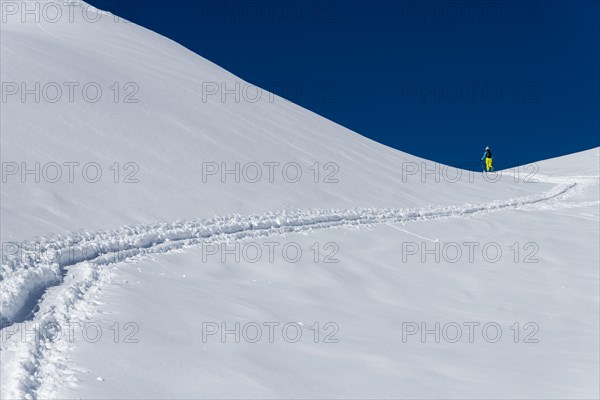 Ski mountaineer in winter landscape