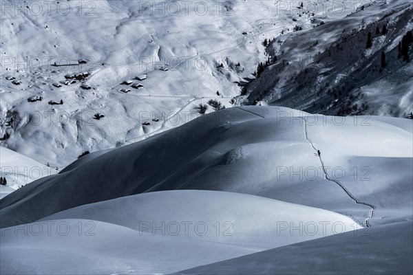 Ski mountaineers in winter landscape