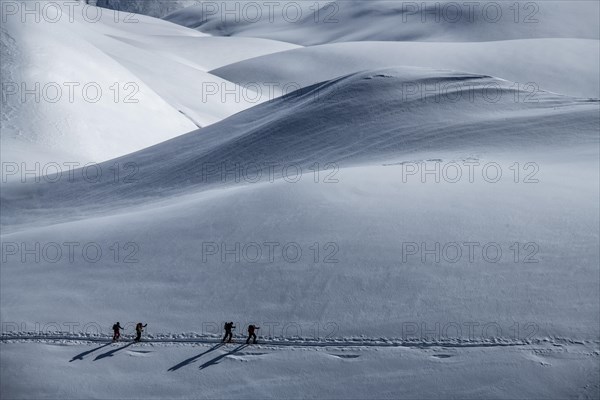 Ski mountaineers in winter landscape