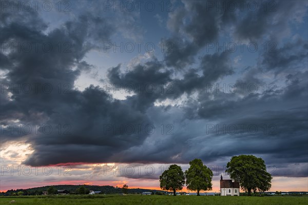 Fourteen emergency helpers chapel with dramatic cloud sky