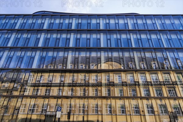 Blue glass facade with reflection