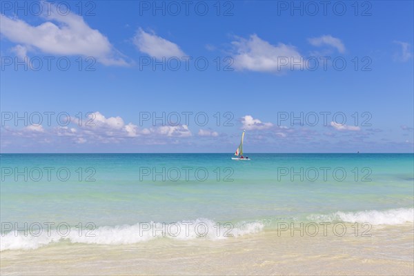 Sailboat in turquoise water