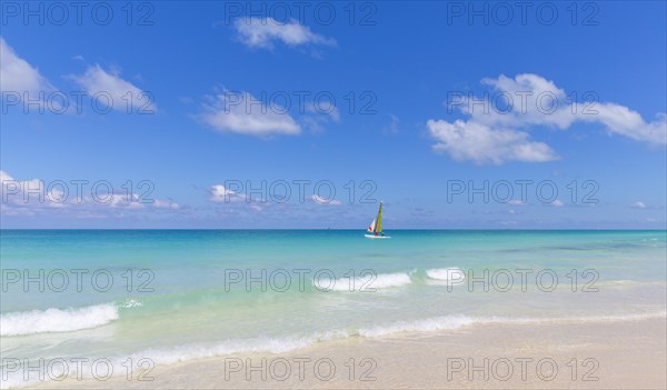 Sailboat in turquoise water