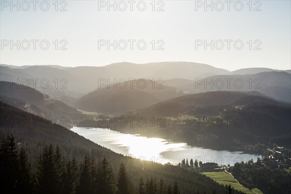 View from Hochfirst to Lake Titisee and Feldberg mountain at sunset