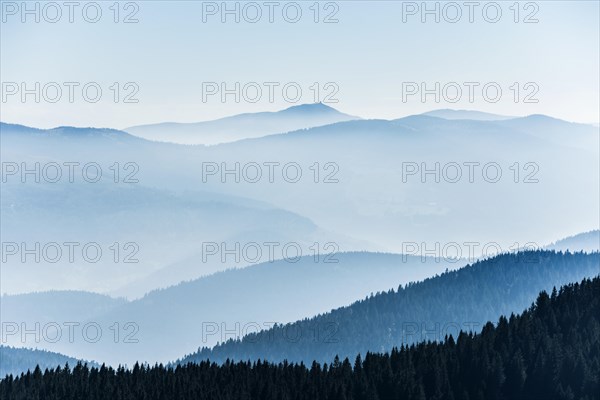 Staggered mountain ranges in the haze