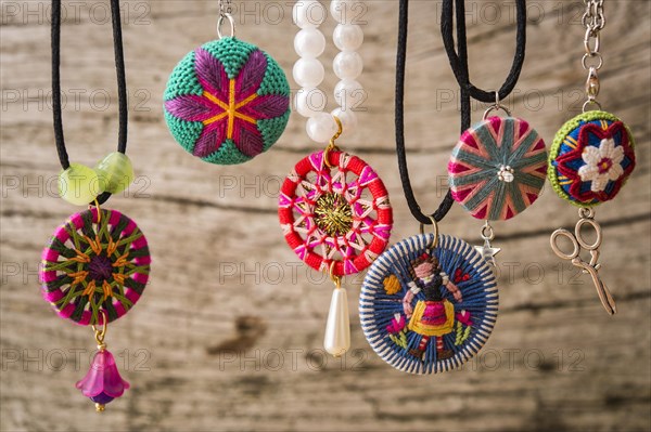 Six assorted Posamentenknopf buttons in red