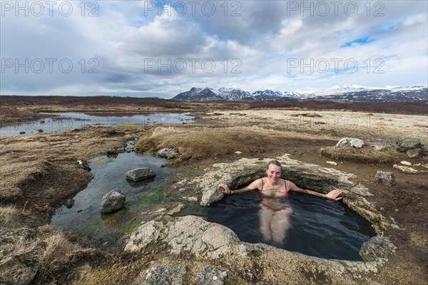 Young woman in hot spring