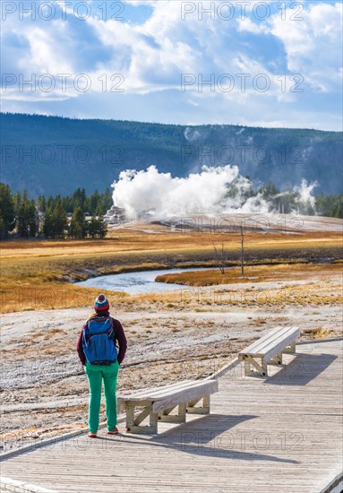 Tourist observes eruption of Castle Geysir