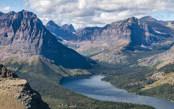 View from Continental Divide Trail onto Mountain Lake Two Medicine Lake with mountain landscape