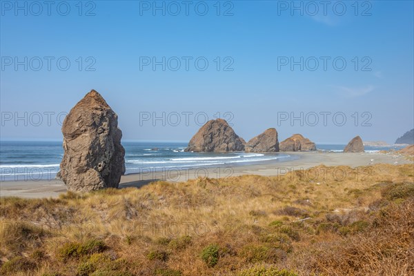 View over sandy beach and large monolithic rocks