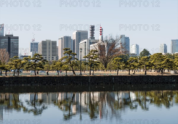 High-rise buildings reflected in a canal