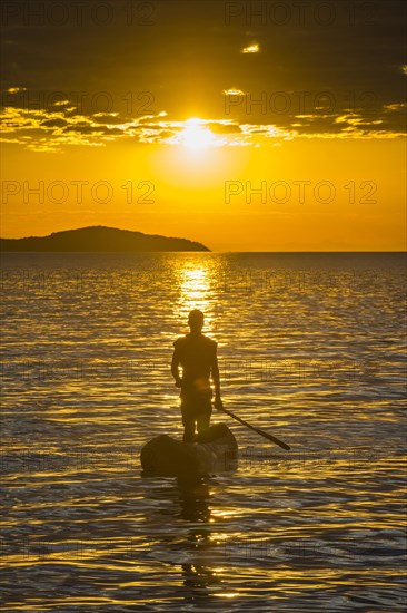 Fisherman in his canoe on Lake Malawi