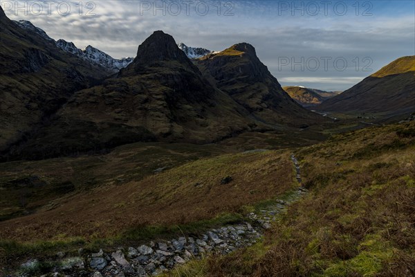 Hiking trail in mountain scenery with peaks of Stob Coire nan Lochan