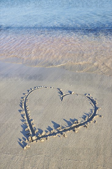 Heart paintet in sand