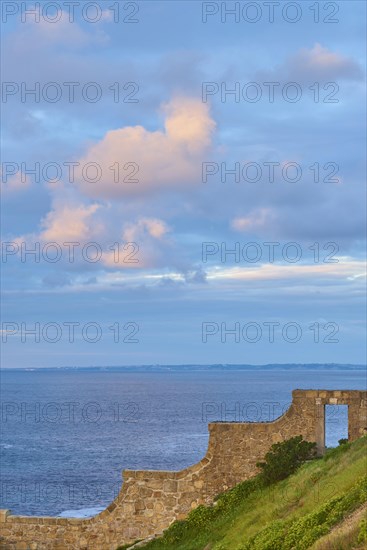 Door trough a wall to the beach of the atlantic ocean at Hondarribia