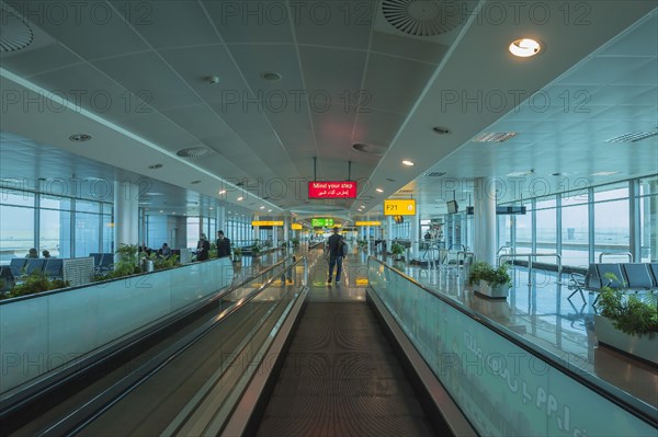 Moving walkway and signs at the airport