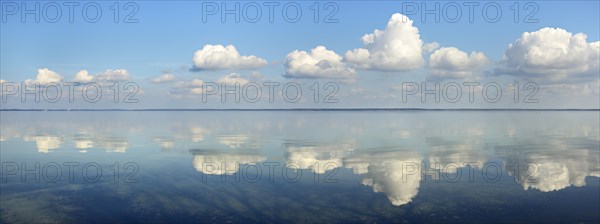 Clouds are reflected in the calm water