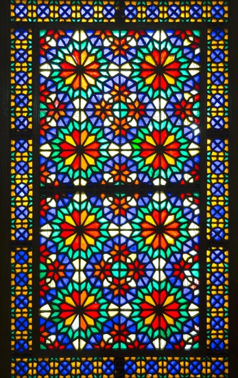 Ornamental colourful window at Bagh-e Dolat Abad