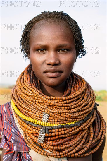 Portrait of a traditional Nyangatom woman with necklaces