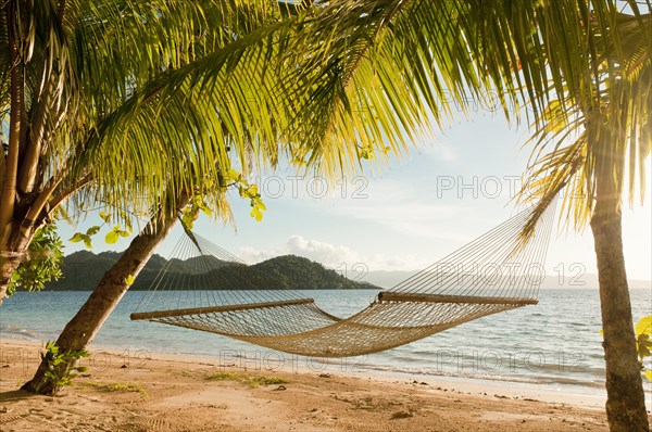 Hammock on beach at Matangi Private Island Resort