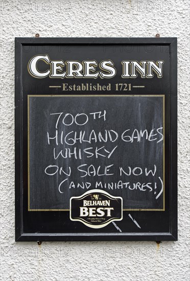 Restaurant sign displaying 700th Highland Games Whiskey
