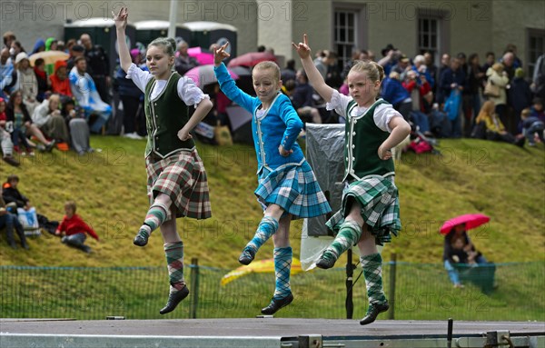 Girls dancing in kilts at a folk dance competition