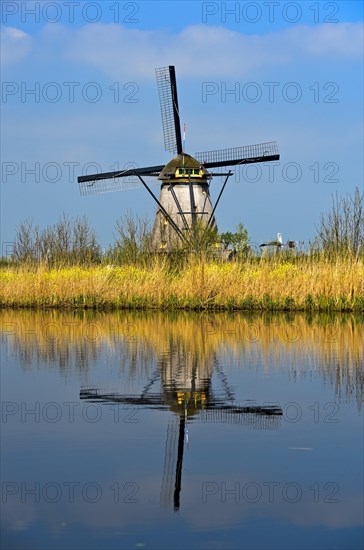 Dutch windmill on a canal
