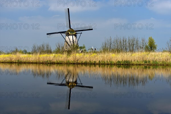 Dutch windmill on a canal