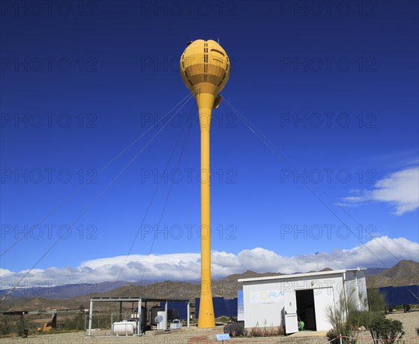 Heliostats reflecting sunrays to receiver tower