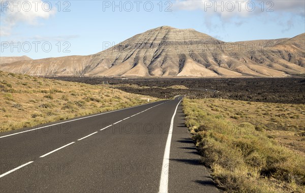 Road leading towards volcanic landscape