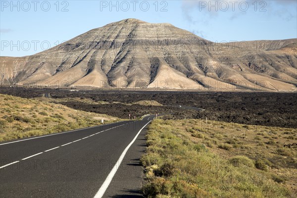 Road leading towards volcanic landscape