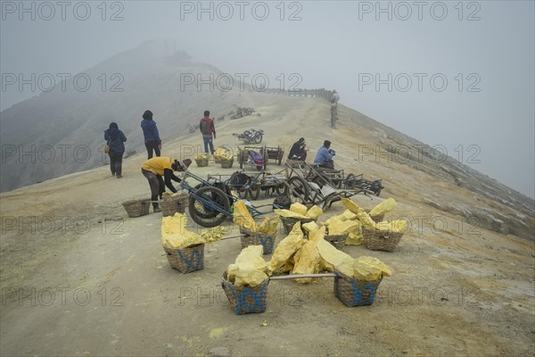 Sulphur is mined on Ijen volcano ridge