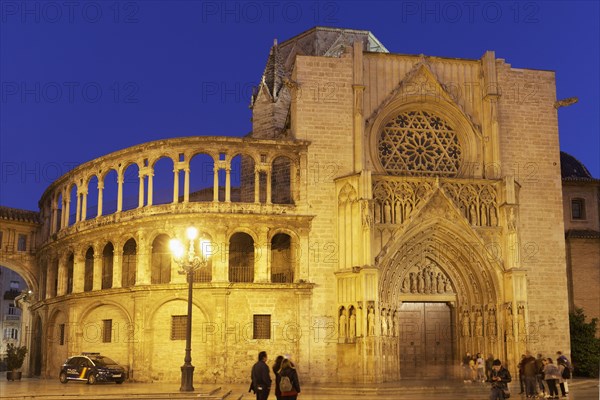 Illuminated gothic apostle portal of the cathedral of Valencia