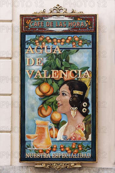 Advertising board for the cocktail Agua de Valencia at a cafe