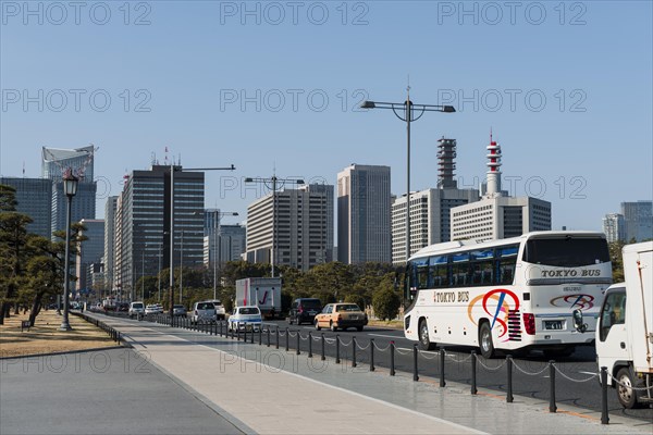 Dense traffic in front of skyscrapers