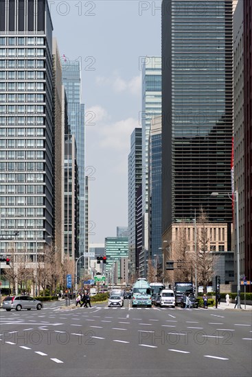 Road traffic between skyscrapers in downtown