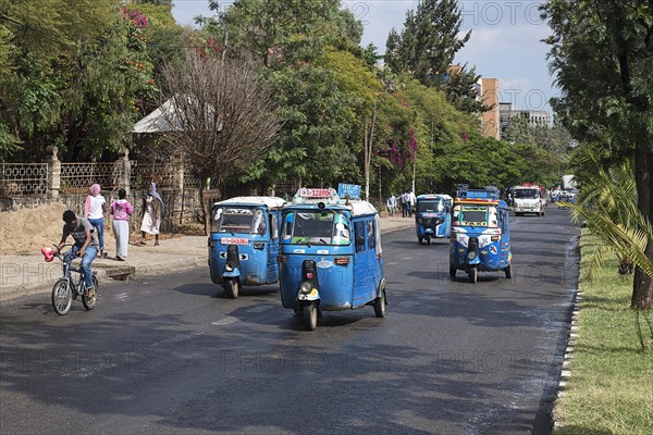 Tuk-Tuks driving on the road