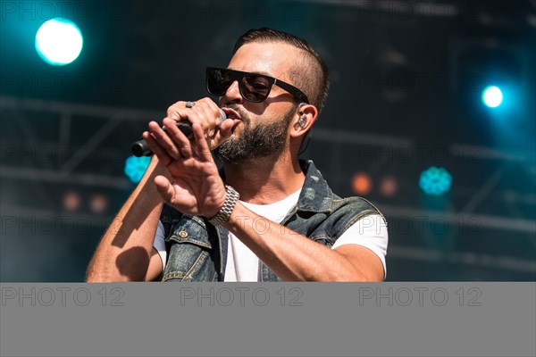 The swiss rapper and musician Marco Bliggensdorfer alias Bligg live at the 26th Heitere Open Air in Zofingen