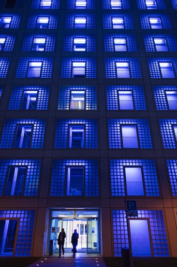 Illuminated city library at night