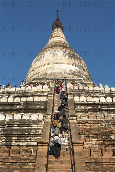 Visitors climb steep steps of Shwesandaw Pagoda