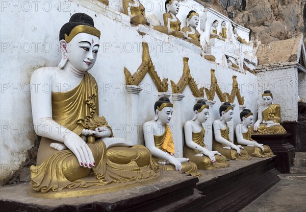 Line of Buddha statues at Kaw-goon