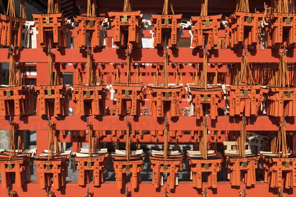 Ema wish plaques in the shape of orange torii gate