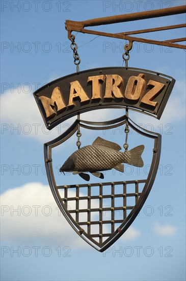 Traditional Hungarian fish restaurant sign
